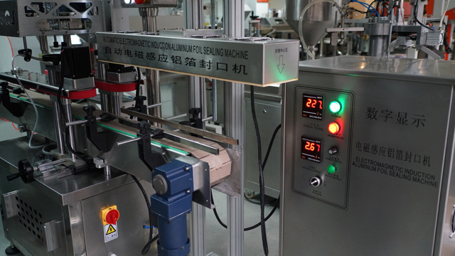 aluminum induction foil sealing machine запечатывающая машина автоматическая.jpg